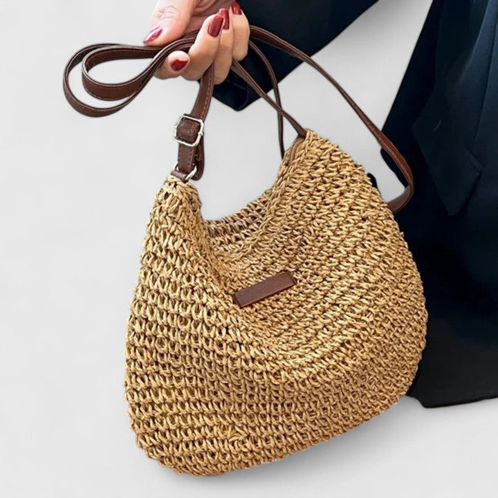 Women's structured handbag with top handles and zip closure